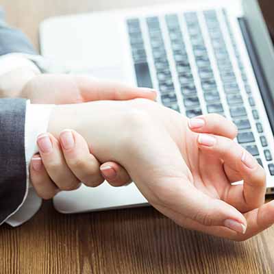 Office worker with pain in wrists