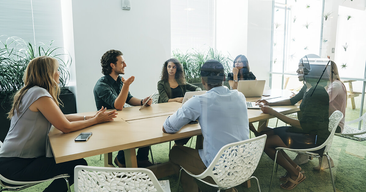 group of people meeting around a table