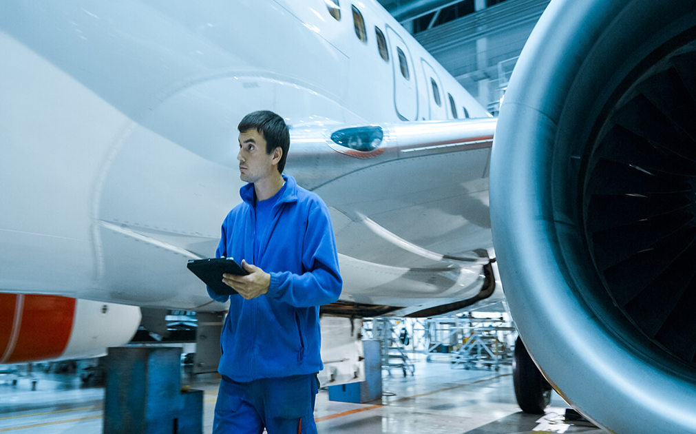 Worker near airplane engine