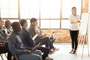 Instructor teaching class of adults