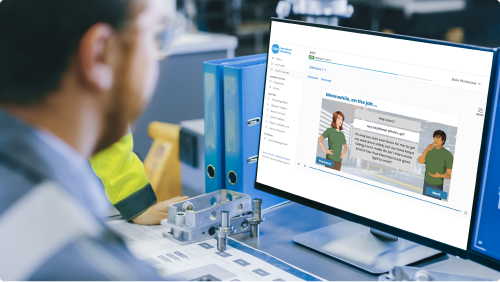 Man sitting at a desk working on a computer