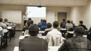 OSG facilitator training a classroom full of trainers